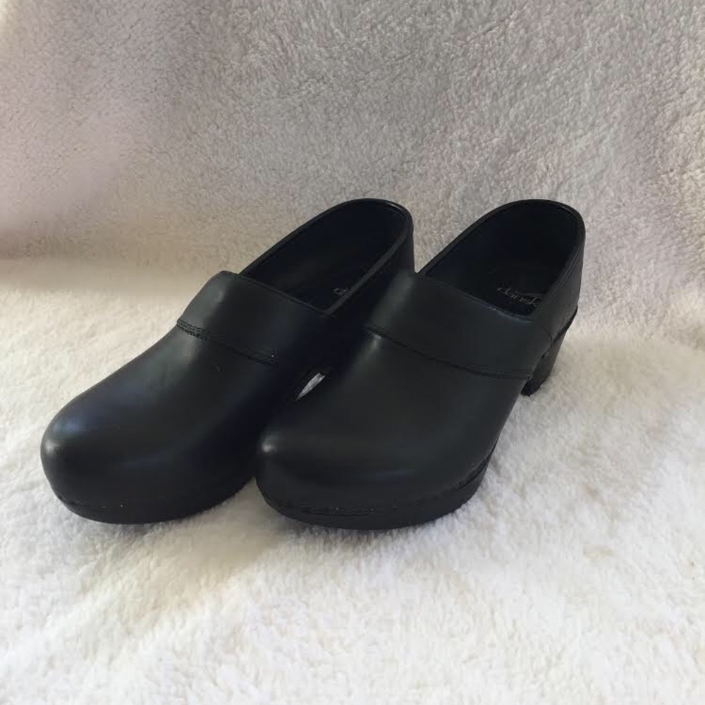 Women’s casual black Dansko clogs with 2” heel